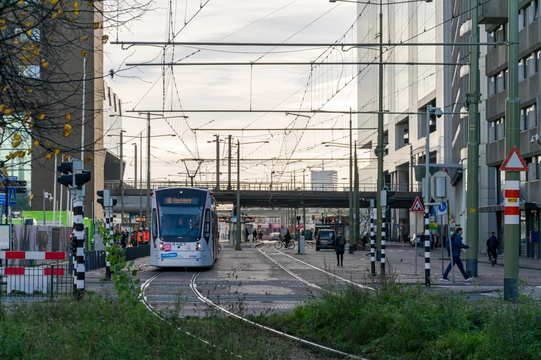 tram on a street full with high rise buildings