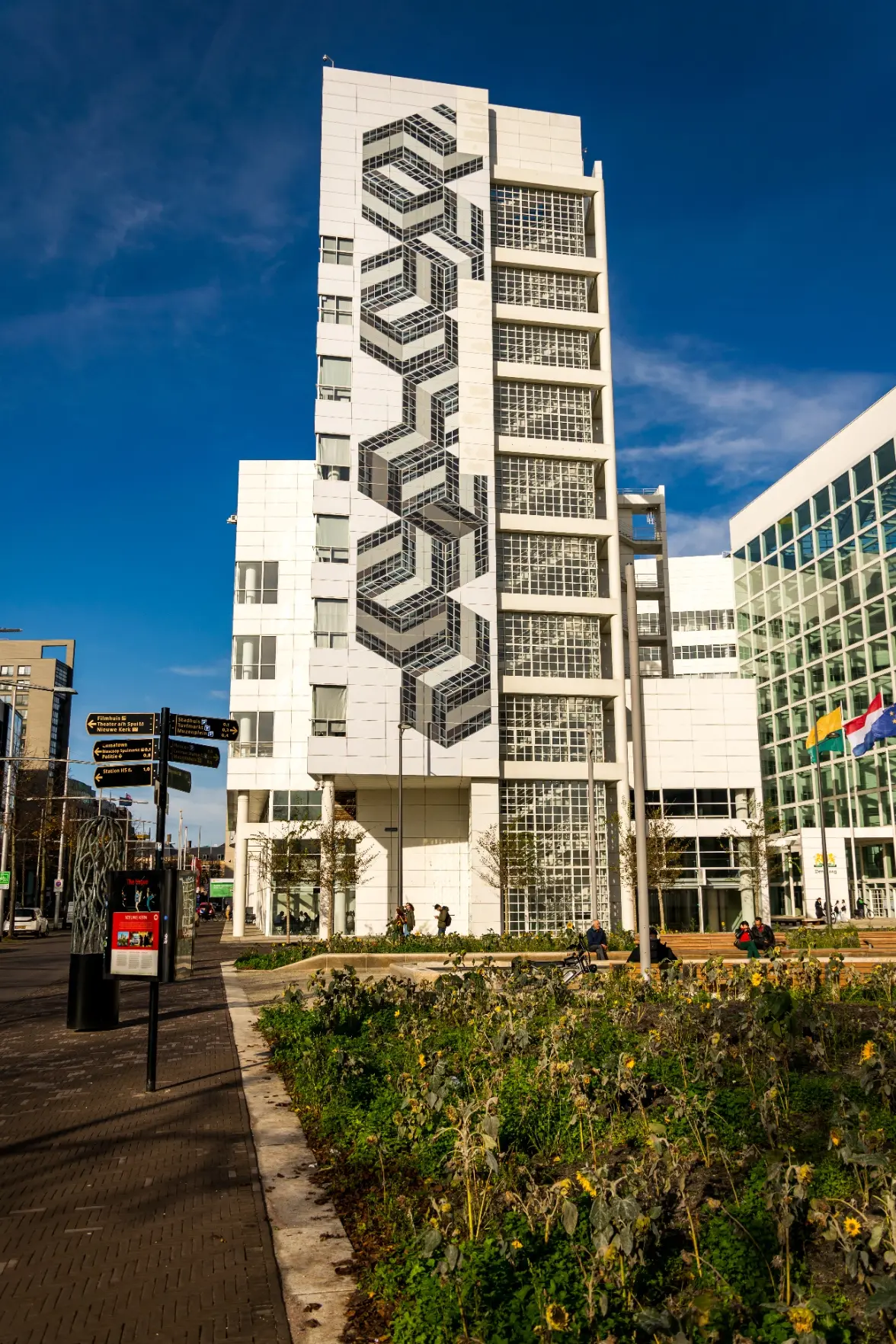 big white building with big cube-y mosaic thing spanning the whole height of it