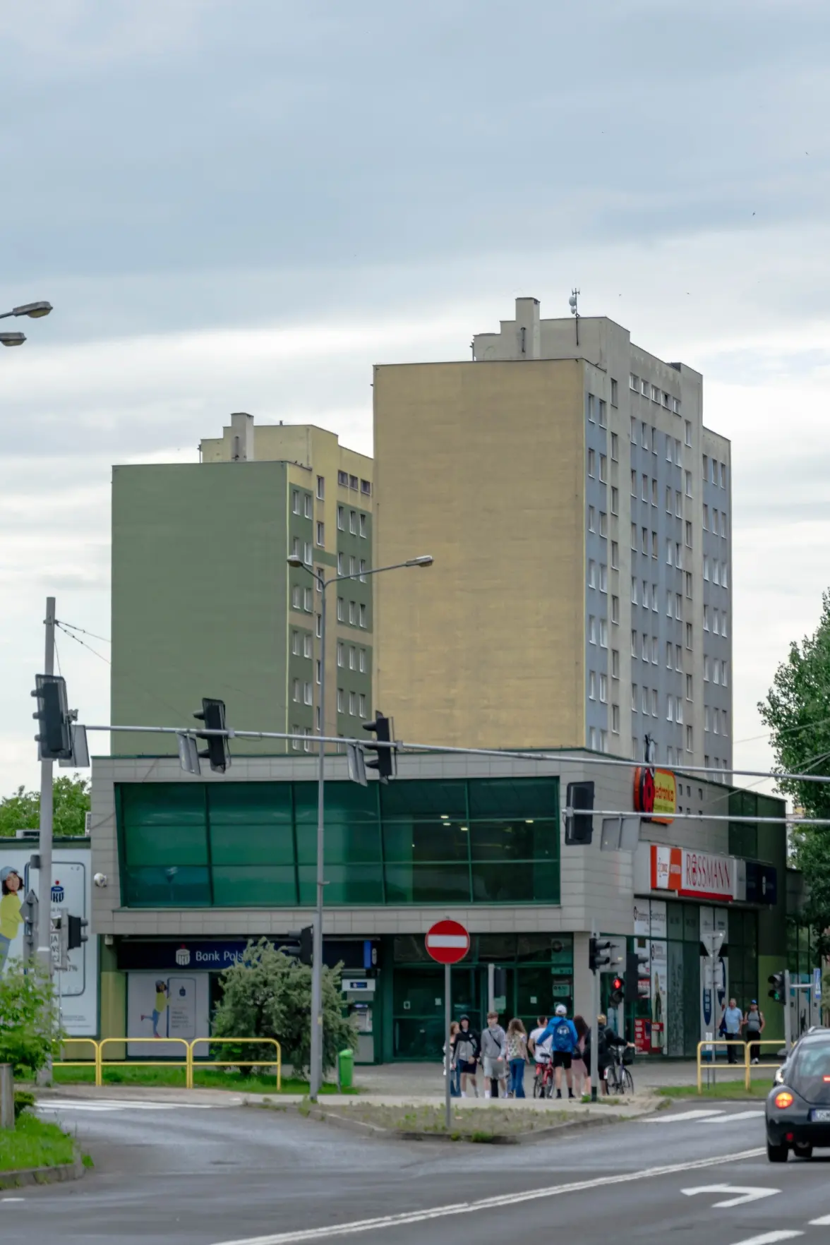 two commie blocks rising above a supermarket