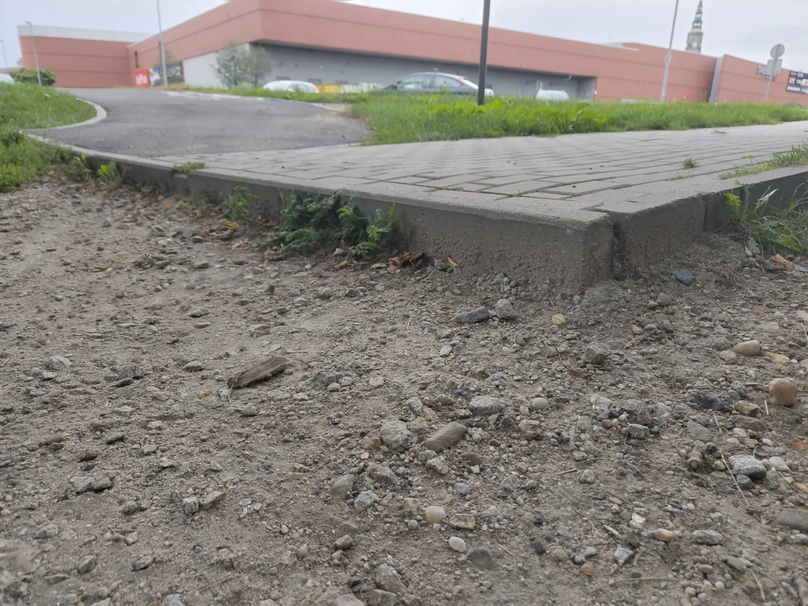 a huge fucking step between ground and an abruptly ending sidewalk/bike path combo, you can trip over and not notice it