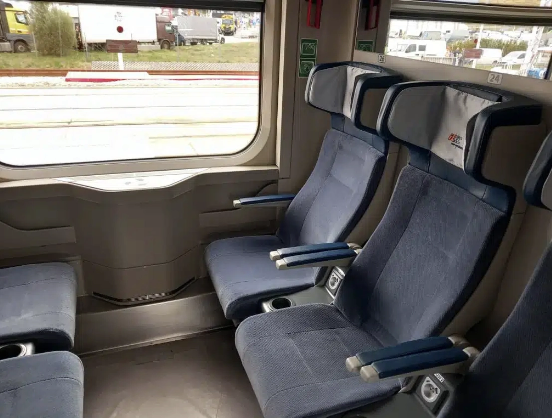 second class compartment in new coaches for PKP Intercity, no wooden accents and no tables compared to a mock-up from a year ago, and leather on the armrests doesn't cover all of it, they have deeper headrests though