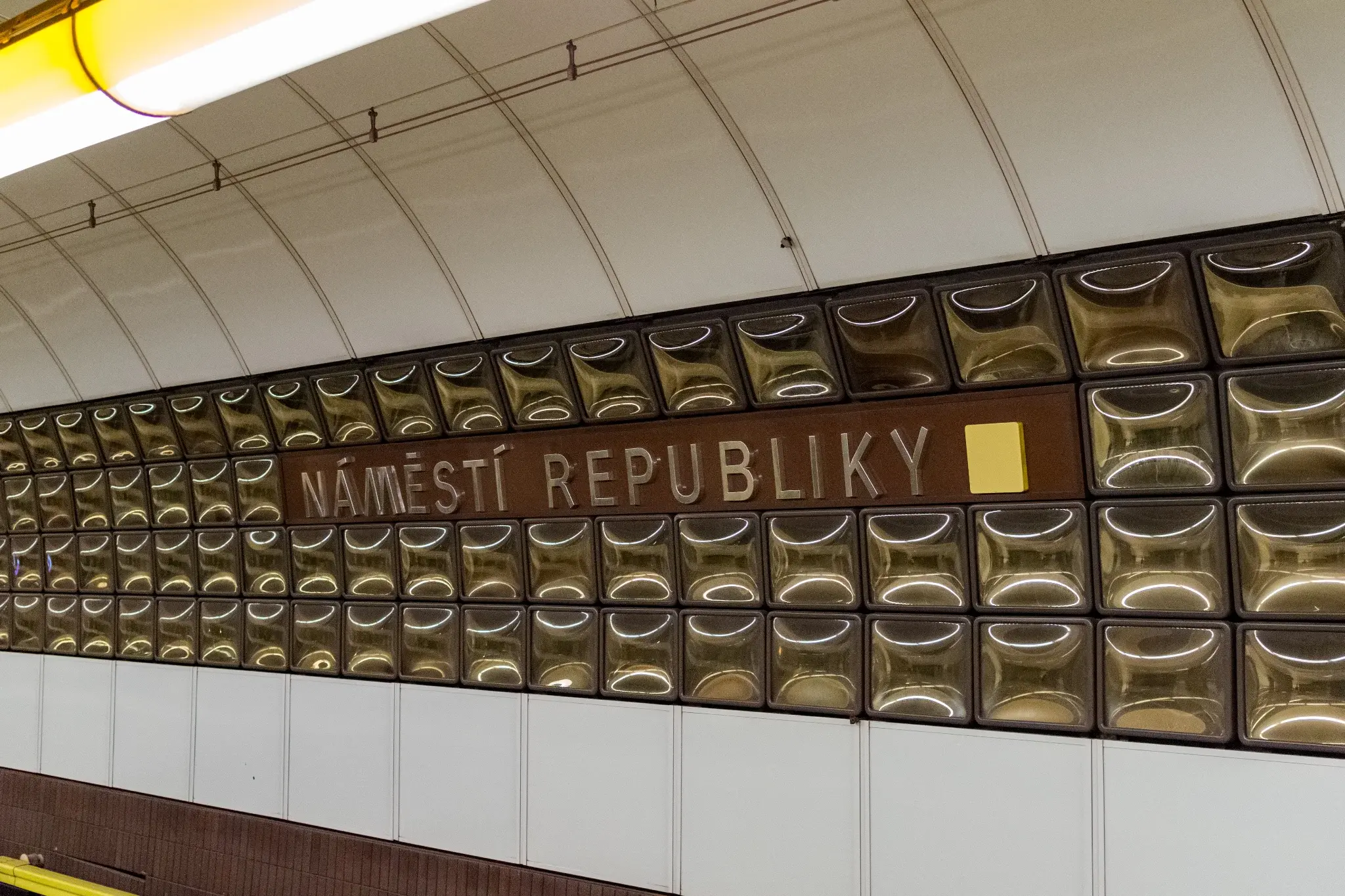 glass decor thing on the wall in the station