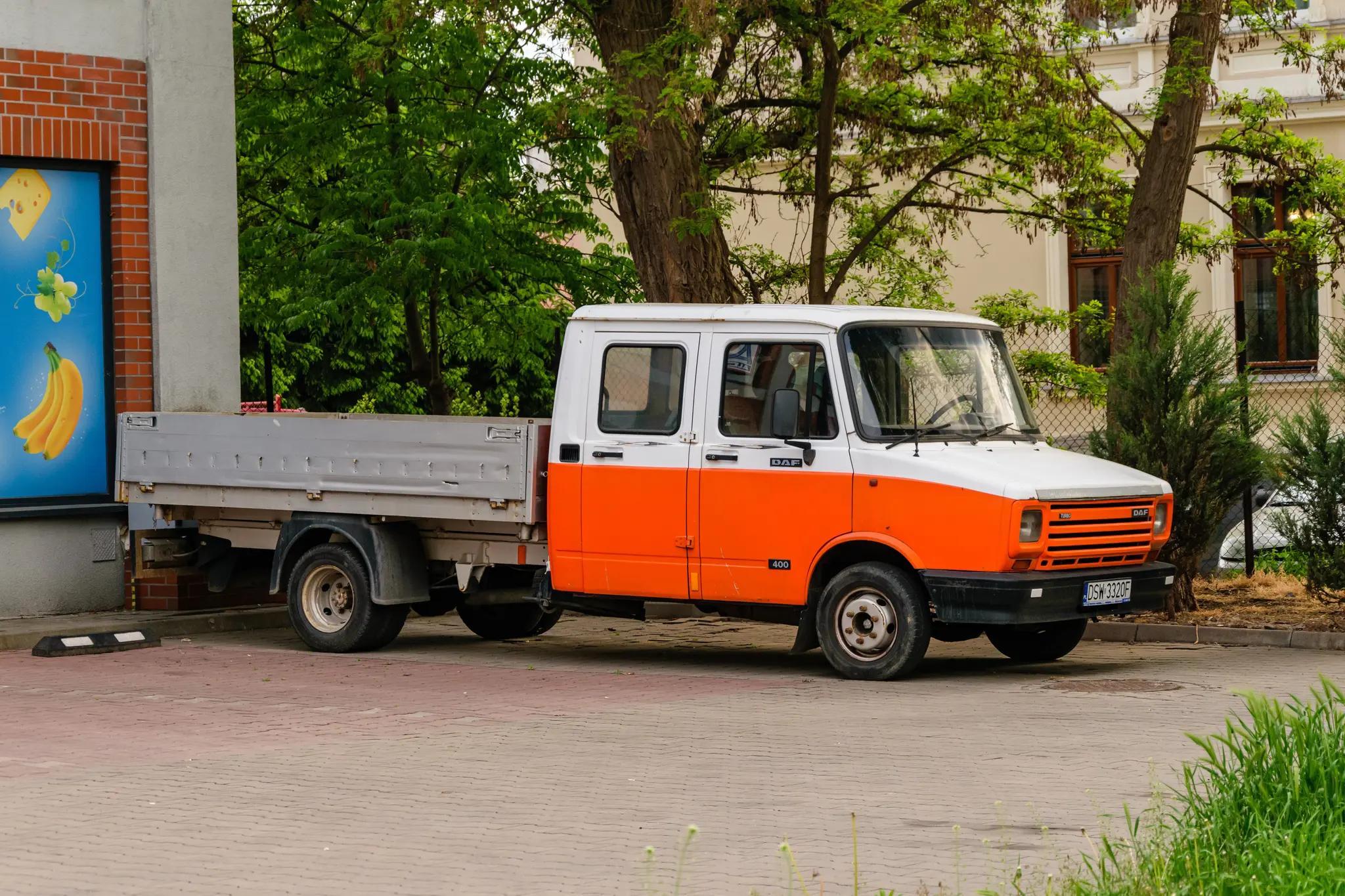 Old white-red DAF truck with pickup bed