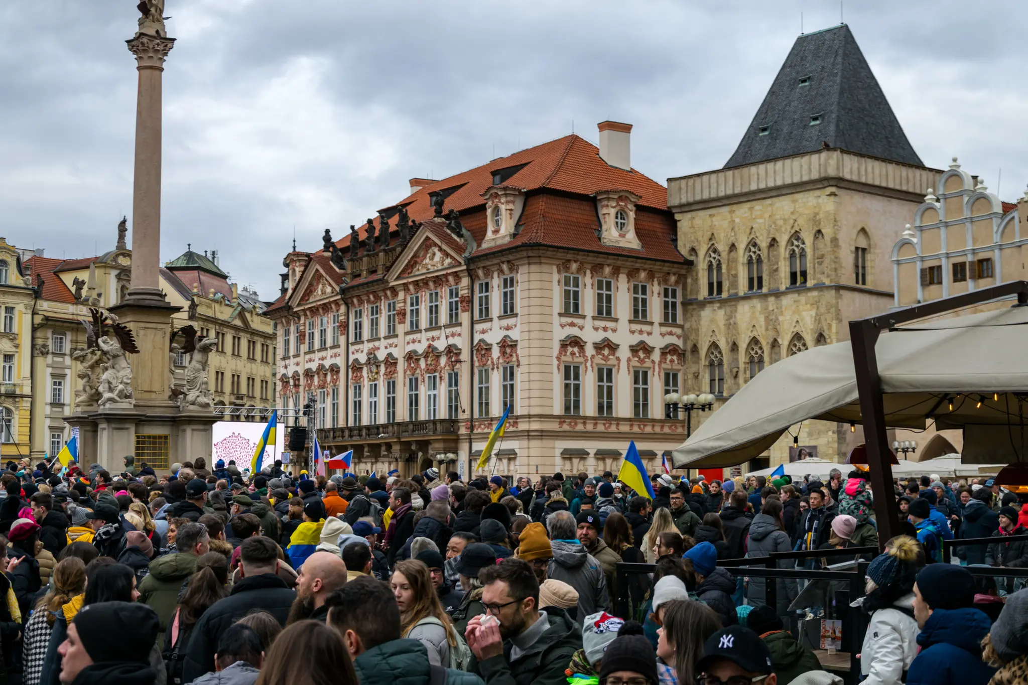 Another shot of crowded old town square, with Czech and Ukrainian flags