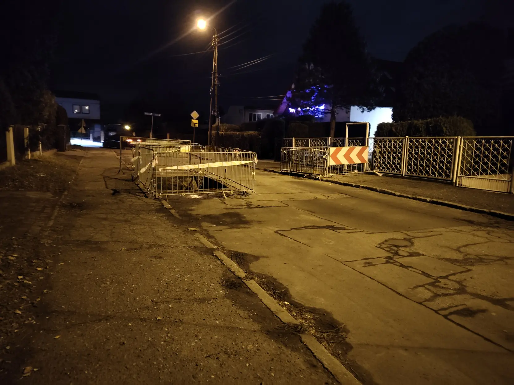 street surrounded by two deep roadwork thingies