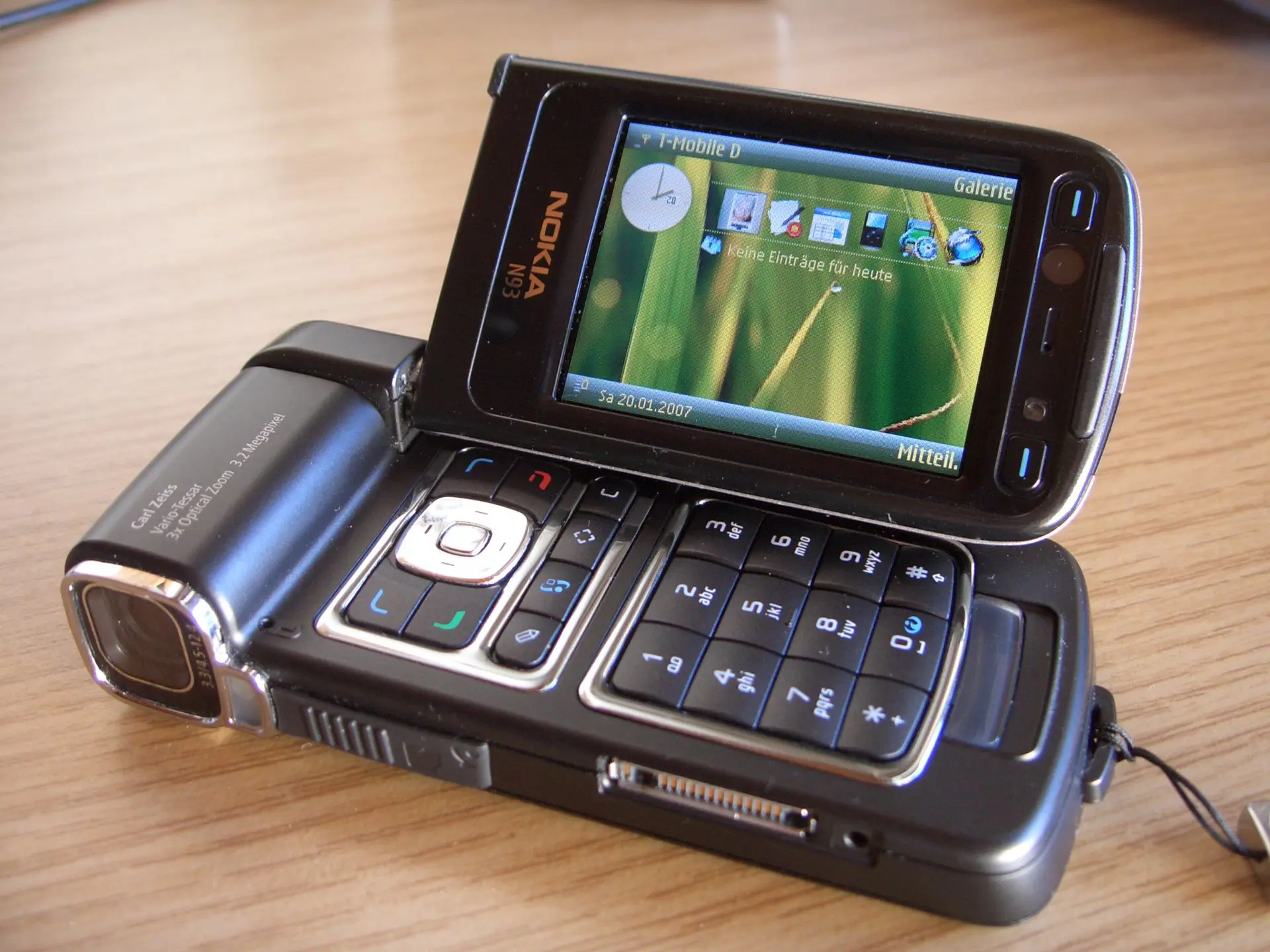 Nokia N93 clamshell phone with a camera in place where you'd have a swivel, screen itself swivels on one hinge and can be used in vertical and horizontal orientations
